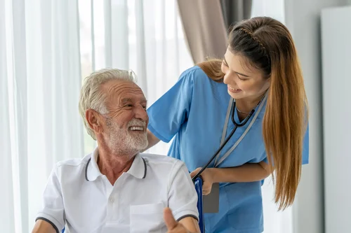 Caregiver holding a patient hand